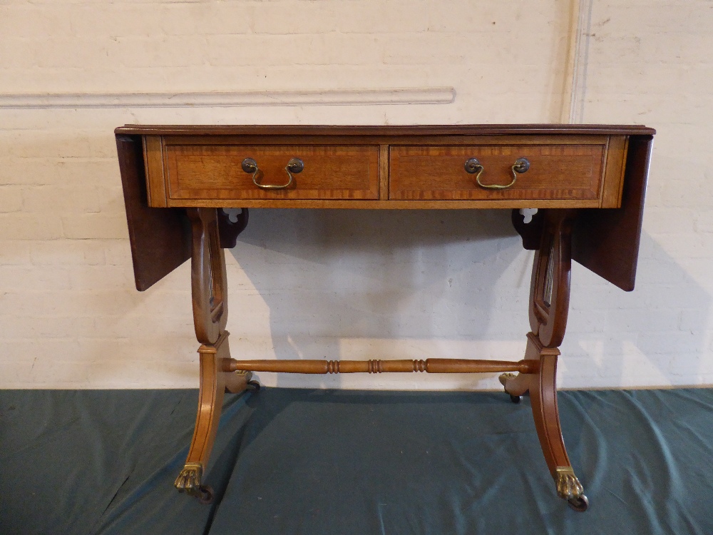 A Reproduction Two Drawer Crossbanded Drop Leaf Sofa Table with Lyre Supports,