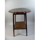 An Edwardian Oak Circular Topped Occasional Table with Stretcher Shelf,