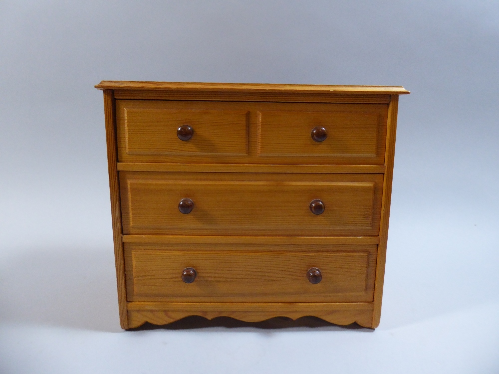 A Miniature Pine Chest of Two Short and Two Long Drawers,