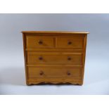 A Miniature Pine Chest of Two Short and Two Long Drawers,