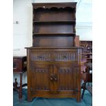 A Linen Fold Oak Dresser, The Base with Two Drawers of Panel Drawers to Cupboard, Raised Plate Rack,