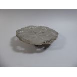 A Pierced Persian Silver Dish on Three Feet with Engraved Foliate Decoration, 23cm Diameter,