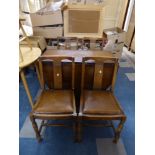 An Oak Drop Leaf Dining Table and Four Chairs