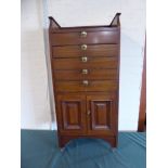 An Edwardian Mahogany Music Cabinet with Five Drawers and Cupboard Base and Raised Gallery,