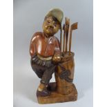 A Carved Wooden Study of a Golfer,