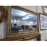 A Rectangular Framed Wall Mirror with Bevelled Glass,