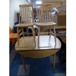 A Drop Leaf Kitchen Table and Two Spindle Back Chairs