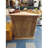 A Pine Wall Hanging Corner Cabinet with Panelled Doors to Shelved Interior,
