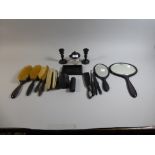 A Collection of Ebony Dressing Table Brushes, Mirrors, Candle Sticks,