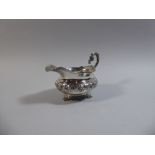 A Large Georgian Silver Cream Jug with Floral Decoration and Three Scrolled Feet, London Hall Mark,