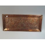 An Arts and Crafts Beaten Copper Panel Decorated with Thistles,