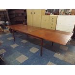 A Swedish Extending Teak Dining Table on Square Tapering Legs,