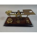 A Set of Mordan Postage Scales with Weights on Stepped Wooden Plinth,