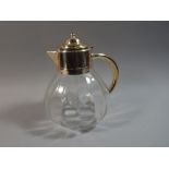 A Silver Plate Topped Glass Jug with Hot/Cold Inner Section,