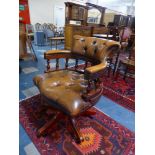 A Swivel Office Armchair with Buttoned Upholstery,