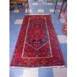 An Antique Malayer Rug on Red Ground 212x117cm