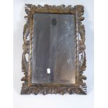 A Carved Wooden Framed Wall Mirror,