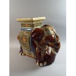 A Large Ceramic Seat in The Form of An Elephant, Decorated in Multi Colour Enamels,