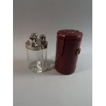 A Leather Cased Three Bottle Travelling Tantalus,