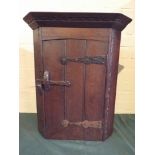 A Small Oak Wall Hanging Corner Cabinet with Iron Hinges,