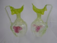 Two Victorian Vaseline Ware Jugs, with floral decoration, one with a small area of loss to the