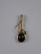 A Lady's 9ct Gold Garnet Cabachon Treble Clef Pendant, approx 11 x 9 mm, approx 3.8 gms