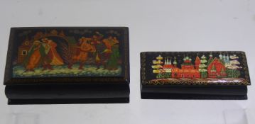 Two Russian Enamel Painted Boxes, depicting various scenes.