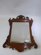 A Mahogany Carved Wall Mirror, approx 36 x 53 cms. (wf)