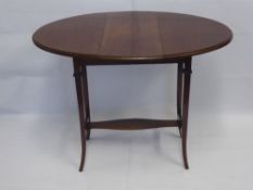 An Oval Mahogany Drop Leaf Table, approx 56 x 90 x 70 cms.