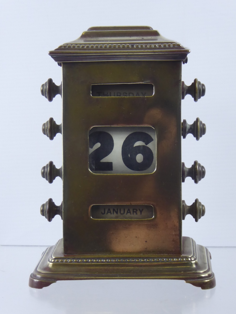 A Brass Desk Calendar, circa 1912 with inscription to the base.