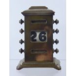 A Brass Desk Calendar, circa 1912 with inscription to the base.