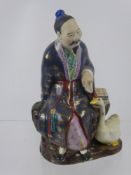 A Chinese Figure of a Man, together with a set of six enamel teaspoons.