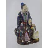 A Chinese Figure of a Man, together with a set of six enamel teaspoons.