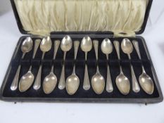 A Set of Twelve Solid Silver Teaspoons, Birmingham hallmark dd 1930, mm AJB, in the original box.