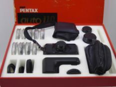 An Asahi Pentax Auto 110 SLR System Camera, in the original box with accessories including 25.5mm