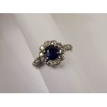A Lady's Antique Platinum Royal Blue Sapphire and Diamond Ring, the deep royal blue cushion set