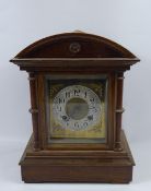An Oak Cased Mantle Clock, the clock having silvered face and numbered dial.