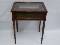 A Mahogany Inlaid Glass Top Vitrine, the display case raised on reeded legs, approx 60 x 40 x 75