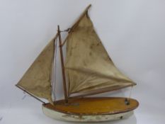 A Mid 19th Century Pond Yacht, timber hull and linen sails, (would benefit from restoration).