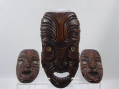 Three New Zealand Wooden Fang Mask Carvings, with abalone shell eyes.