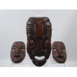 Three New Zealand Wooden Fang Mask Carvings, with abalone shell eyes.