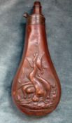 An Antique Copper Powder Flask, decorated with hares and pheasants, three position adjustable