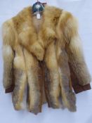 A Vintage Lady's Red Fox and Suede Car Coat, approx length 77 cms.