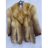 A Vintage Lady's Red Fox and Suede Car Coat, approx length 77 cms.