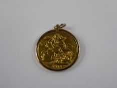 A 1912 Full Gold George V Sovereign, presented in a 9 ct gold mount, approx 9.4 gms