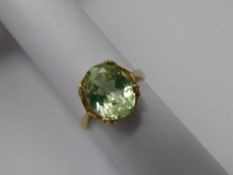A Lady's 9 ct Yellow Gold and Green Stone Ring, stone 10 x 8 mm size J approx wt 2.4 gms.