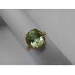 A Lady's 9 ct Yellow Gold and Green Stone Ring, stone 10 x 8 mm size J approx wt 2.4 gms.