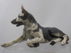 A Ceramic Sculpture of a Seated Alsatian, K. Pudge, approx 30 x 20 cms.