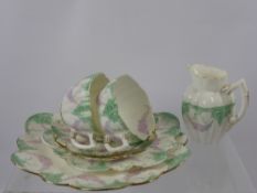 A Fine Porcelain Part Tea Set of Fluted Design, including six cups, twelve saucers, milk jug,