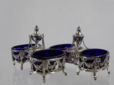 A Pair of Antique Continental Solid Silver Salts. The elaborate twin salts having urn finials with